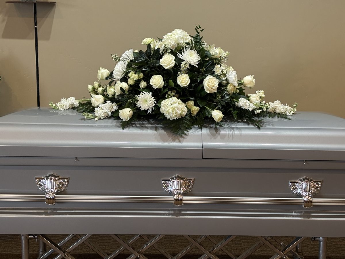 Casket Spray - Elegant all-white casket spray with roses, mums, and hydrangea
