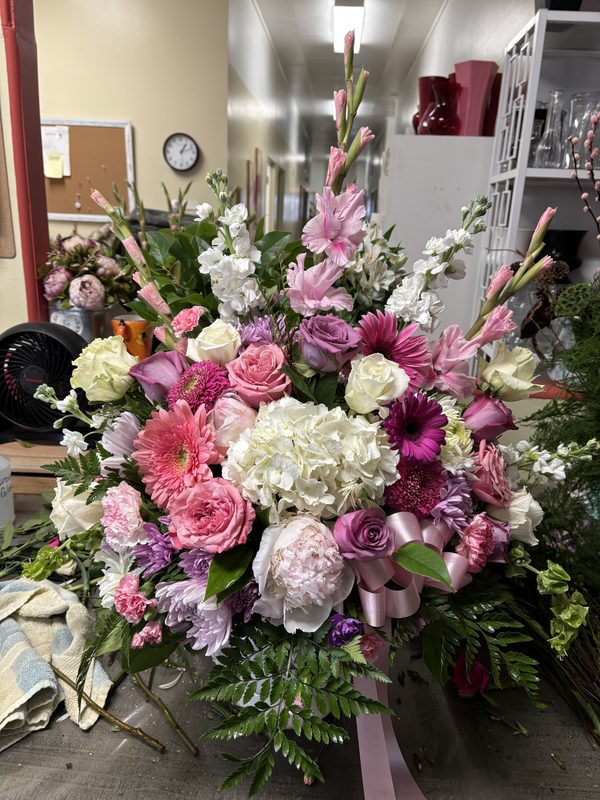 Blushing Garden Tribute - Lush pink, white, and purple standing arrangement