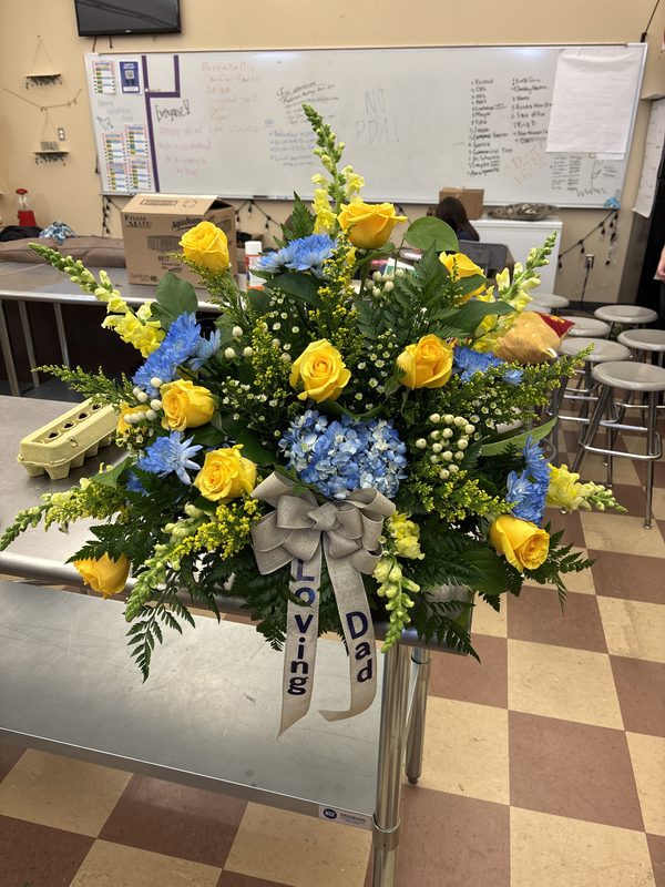 Sympathy Spray - Bright yellow roses with blue hydrangea
